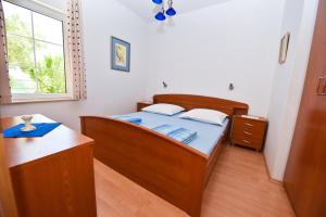 Postel nebo postele na pokoji v ubytování Apartments Smoky