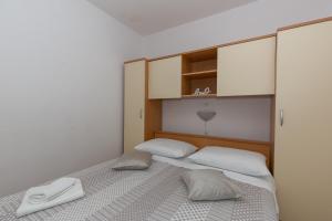 Postel nebo postele na pokoji v ubytování Apartments Tolic