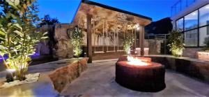 a garden with a tree stump in the middle of a building at Montenegro Royal 2 Bedroom Apartment in Bečići