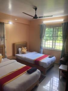 Thanapati Guesthouse客房内的一张或多张床位