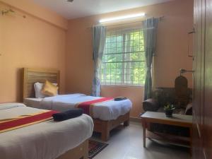 Ліжко або ліжка в номері Thanapati Guesthouse