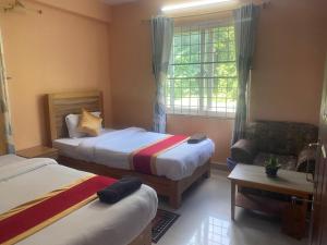 Thanapati Guesthouse客房内的一张或多张床位
