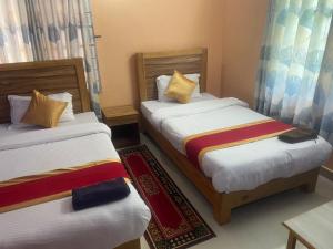Thanapati Guesthouse客房内的一张或多张床位