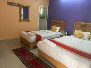 Thanapati Guesthouse客房内的一张或多张床位