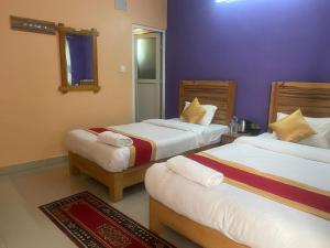Thanapati Guesthouse客房内的一张或多张床位