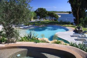 a swimming pool with a view of the water at Résidence Affasciata in Porto-Vecchio