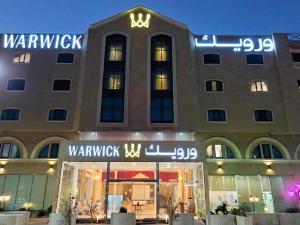 a building with a sign on the front of it at Warwick Al Jubail Hotel in Al Jubail
