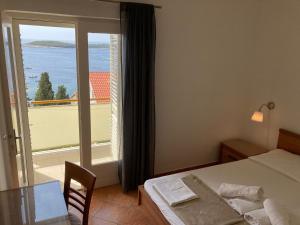 Posteľ alebo postele v izbe v ubytovaní Rooms Vinka Tudor