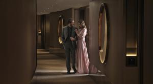 a man and a woman standing in a hallway at Four Seasons Hotel Riyadh in Riyadh