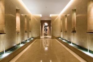 a hallway of a building with a sculpture on the wall at Four Seasons Hotel Riyadh in Riyadh