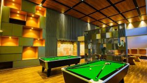 a billiard room with a pool table in it at Weekend Address managed by Global Hospitality in Surat