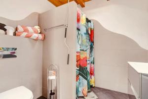 a bathroom with a shower and a toilet at Casa Verde in Teguise