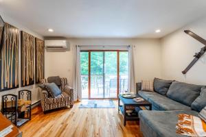 a living room with a couch and a table at Redwood Retreat in Windham - minutes to Mtn! in Windham +24 photos