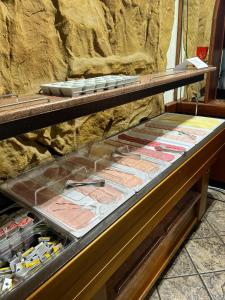 a display case filled with different types of meat at Hotel Daun in Castrop-Rauxel