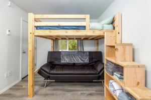 a room with two bunk beds and a chair at AlohAlaska Studio in Girdwood