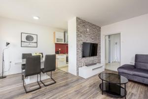 a living room with a couch and a table at Apartment Tina in Ploče