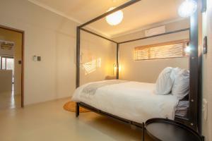 a bedroom with a bed with a large mirror at Cheetah's Run in Marloth Park