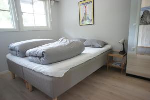 a bed with two pillows on it in a room at Spacious 2-bedroom holiday apartment - Hemsedal Veslehorn 14 in Hemsedal
