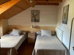 Postel nebo postele na pokoji v ubytování El Cau de Cal Quimet + 8 fotografií