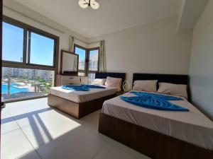 En eller flere senge i et værelse på Studio apartment, Marassi, North coast