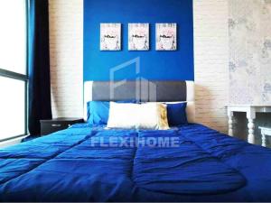 a blue bed in a bedroom with a blue wall at Cozy and Spacious 2 Bedroom, Family Home Cybersquare 21 Cyberjaya, Flexihome-MY in Cyberjaya