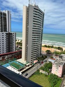 a view of the ocean from the balcony of a building at Puerto de Villas in Recife