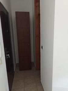 a hallway with a closet and a door at Donata in Osijek