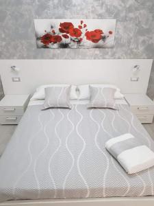 Кровать или кровати в номере Appartamenti Tiziana
