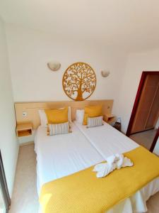 A bed or beds in a room at Guinea Nidive apartment Még 12 kép
