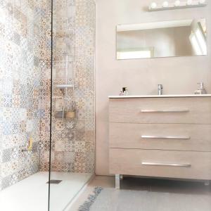 a bathroom with a sink and a mirror at 91 Port Royale Los Cristianos in Los Cristianos