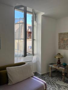 Posteľ alebo postele v izbe v ubytovaní Chambre paisible dans une ancienne bâtisse rénovée