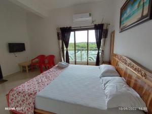 Hotel Kavijay Sea View客房内的一张或多张床位