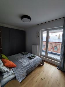 Cama ou camas em um quarto em Bohema Praga Apartments, Metro Szwedzka, near Old Town