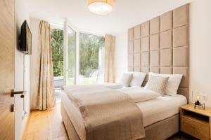 Łóżko lub łóżka w pokoju w obiekcie Granit Appartements