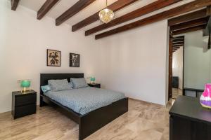 a bedroom with a bed and two night stands at Villa Paradise in Benalmádena +26 photos