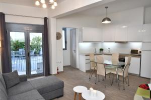 a living room with a couch and a table at Michaela's guesthouse in Nafplio