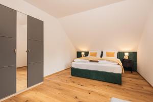 Łóżko lub łóżka w pokoju w obiekcie Granit Appartements