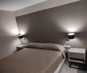 Postel nebo postele na pokoji v ubytování Hotel Alvarado Suites