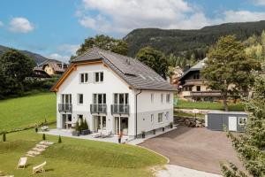 an aerial view of a white house at Granit Appartements in Mauterndorf