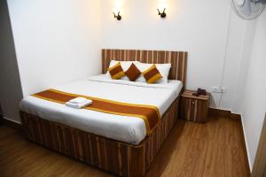 a bedroom with a large bed in a room at PHIBHA VILLA in Shillong