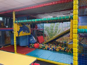 a play room with a play structure with toys at G10 Hoburne Devon Bay pet friendly in Goodrington