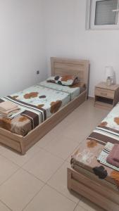 A bed or beds in a room at Mama Marina apartement near to the airport