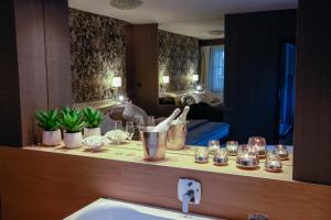 a bathroom with a counter with a sink and a mirror at Penzion Solid Spa in Mladá Boleslav