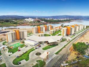 an aerial view of a city with buildings and a river at Resort Praias do Lago in Caldas Novas