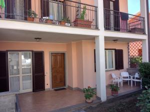 a front porch of a house with a balcony at Casa monte cimino in Soriano nel Cimino