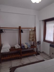 a room with two bunk beds and a window at Departamento vista al mar Playa Las Toscas in Mar del Plata