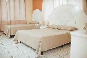Voodi või voodid majutusasutuse Hotel Condesa toas