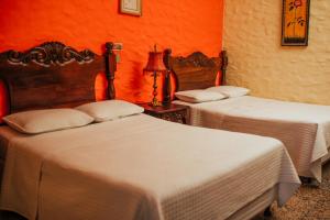 Voodi või voodid majutusasutuse Hotel Condesa toas