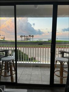 a view of a balcony with a view of the ocean at Sea Chase with an ocean view at Casa Del Mar in Galveston