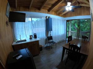 an overhead view of a kitchen and dining room with a table at Laureles Collection Uvita - Cabinas Los Laureles in Uvita